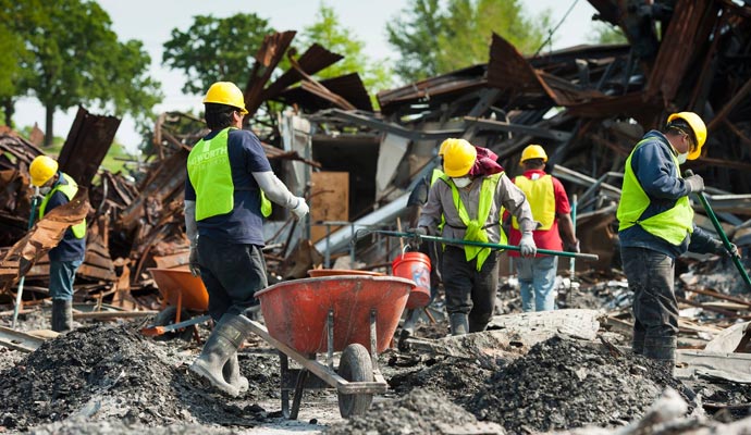 A team of professional cleaners working on a damaged property