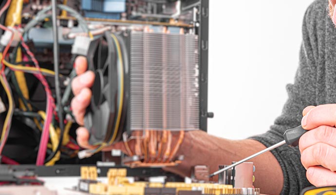 Electrician fixing an electronic device