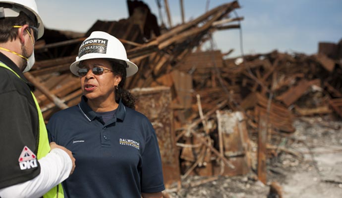 professional team working on a disaster-damaged property